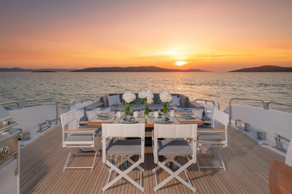 108ft Sunseeker Predator yacht charter Coconut Grove – aft deck dining at sunset
