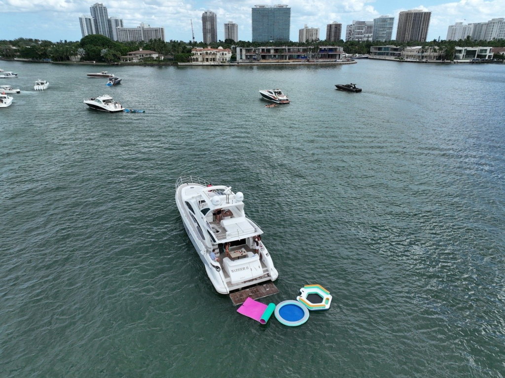 70ft Azimut Flybridge yacht charter Miami Beach – aerial exterior with floating mat