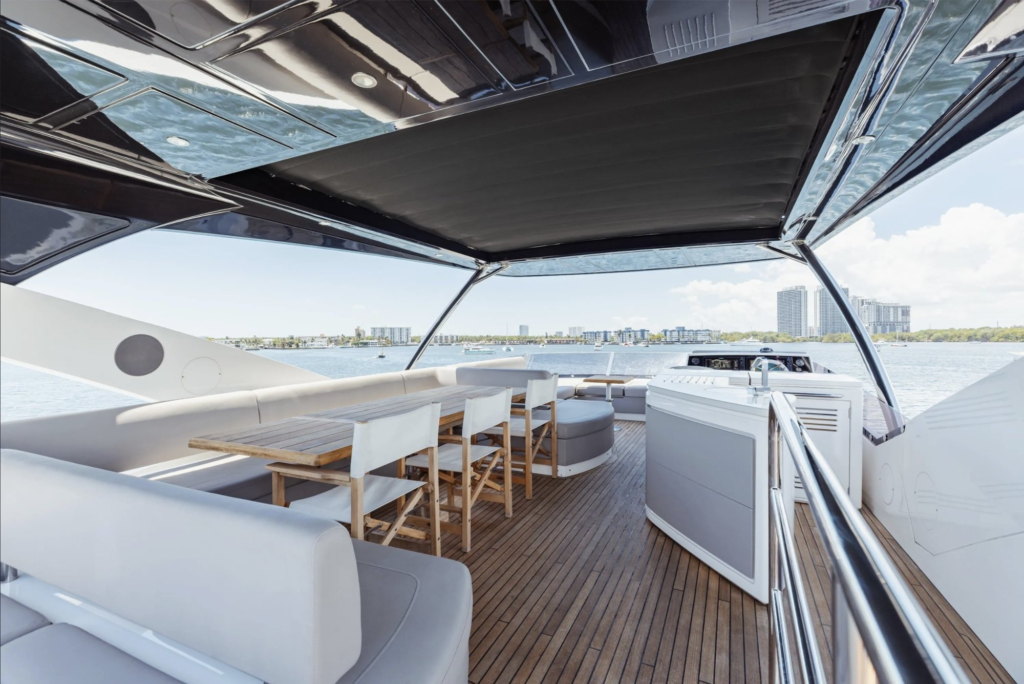 76ft Sunseeker yacht charter Miami – flybridge dining under hardtop