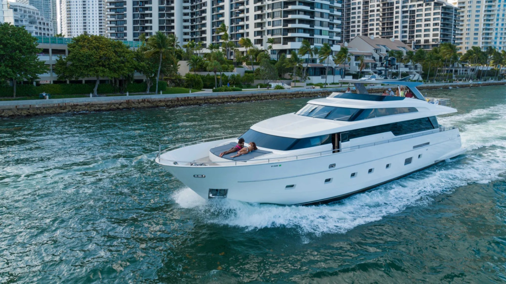 97ft Sanlorenzo yacht charter Miami – running past miami skyline